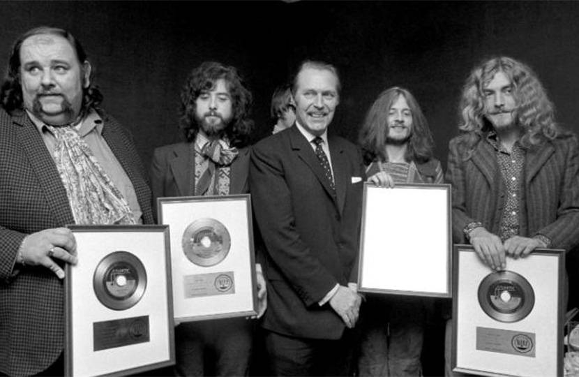 Sir Anthony Grant presenting gold discs to Led Zeppelin.