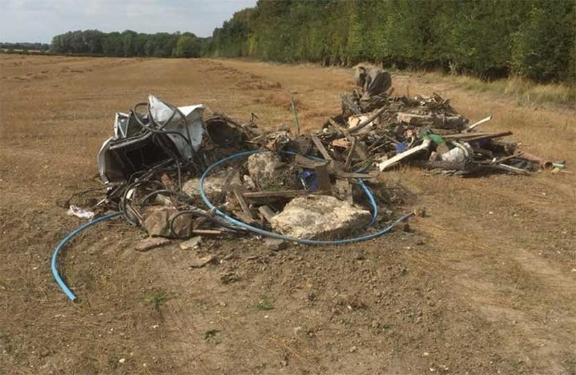 Who pays to clear up this lot of fly-tipped rubbish and legally dispose of it?  Photo: Peter Topping.
