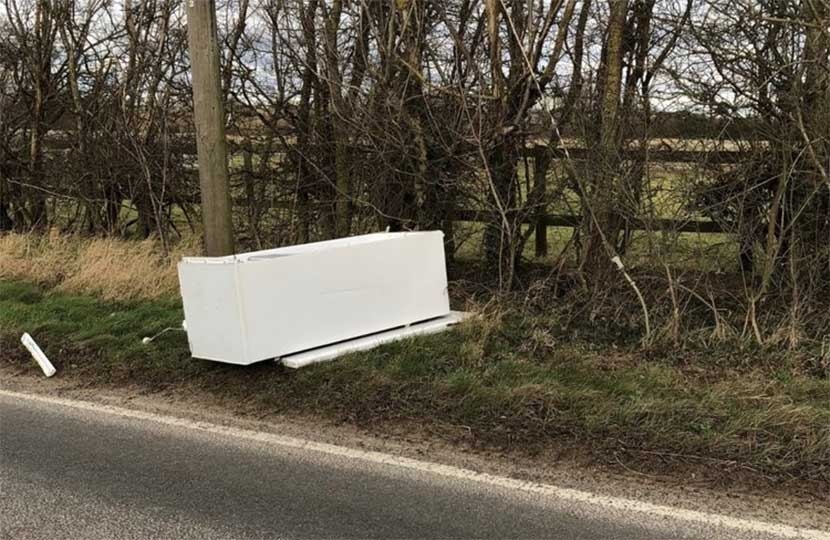 A fridge-freezer dumped by the side of the road – unsightly, illegal and potentially dangerous to motorist and cyclists.  Photo: Peter Topping.